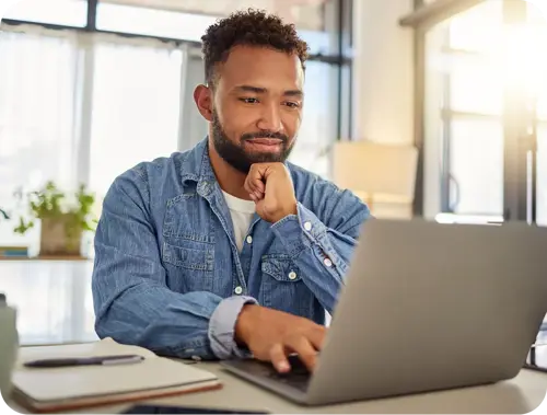 Small business owner comparing gas prices online.